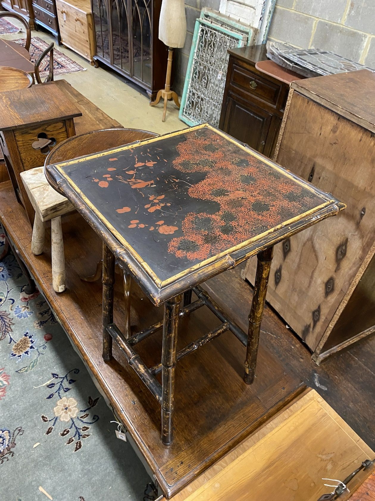 A late Victorian lacquered bamboo square occasional table, height 66cm, a provincial stool, Liberty style oak table and a wine table